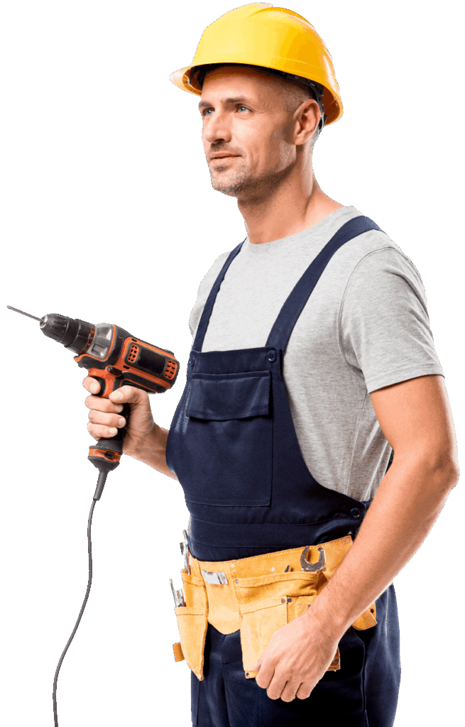 Trabajador de la obra con gorro agarrando una taladradora